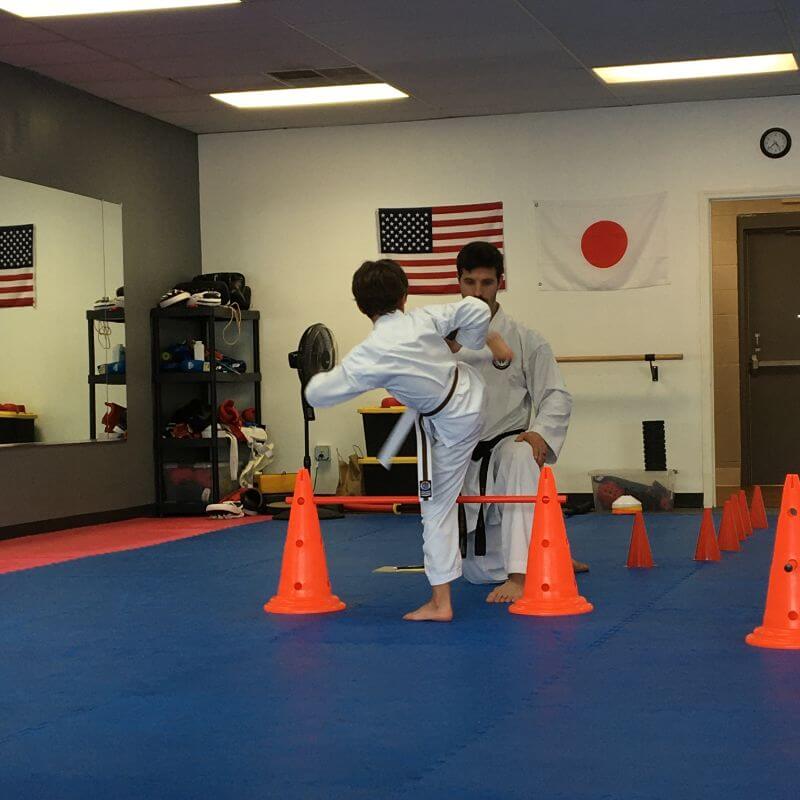 Alejandro Rodríguez at Kazoku Karate Greenville, South Carolina: martial arts school and dojo. Training with a kid of Little Ninjas private karate classes and lessons