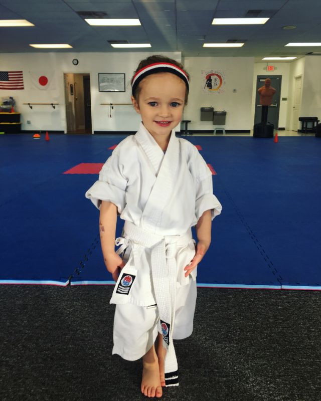 Cute little karate girl training at kazoku Karate school in Greenville, South Carolina, at our martial arts dojo from the Little Ninjas private karate-do lessons for kids