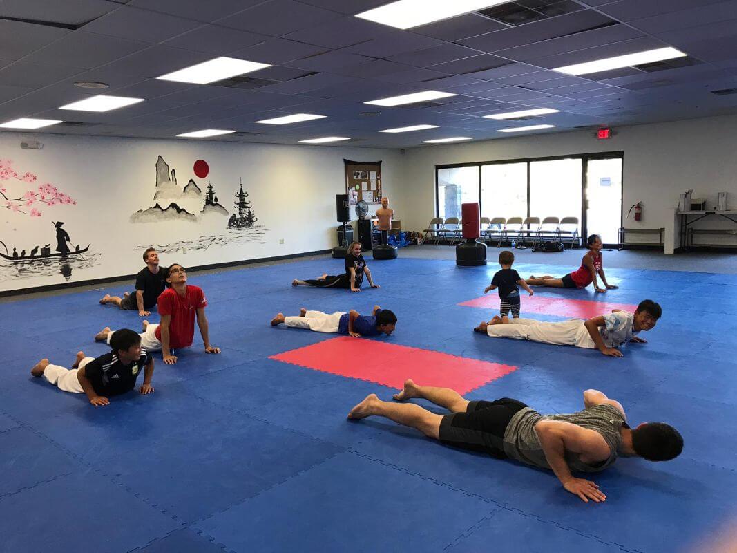 Group of adult karate students training in a private wado-ryu karate-do lesson at Kazoku Karate Greenville, South Carolina: Martial arts schools in USA